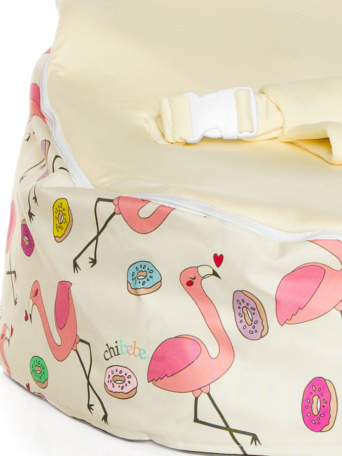 close up of baby bean bag snuggle pod with flamingo design and cream seat by chibebe